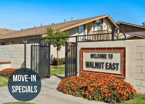 a home with a sign that says welcome to walnut east